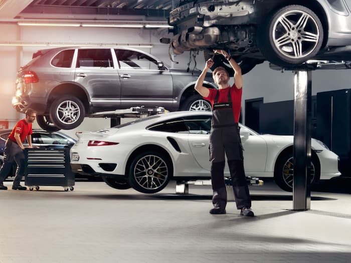 mysite-name workshop with technicians working on vehicles